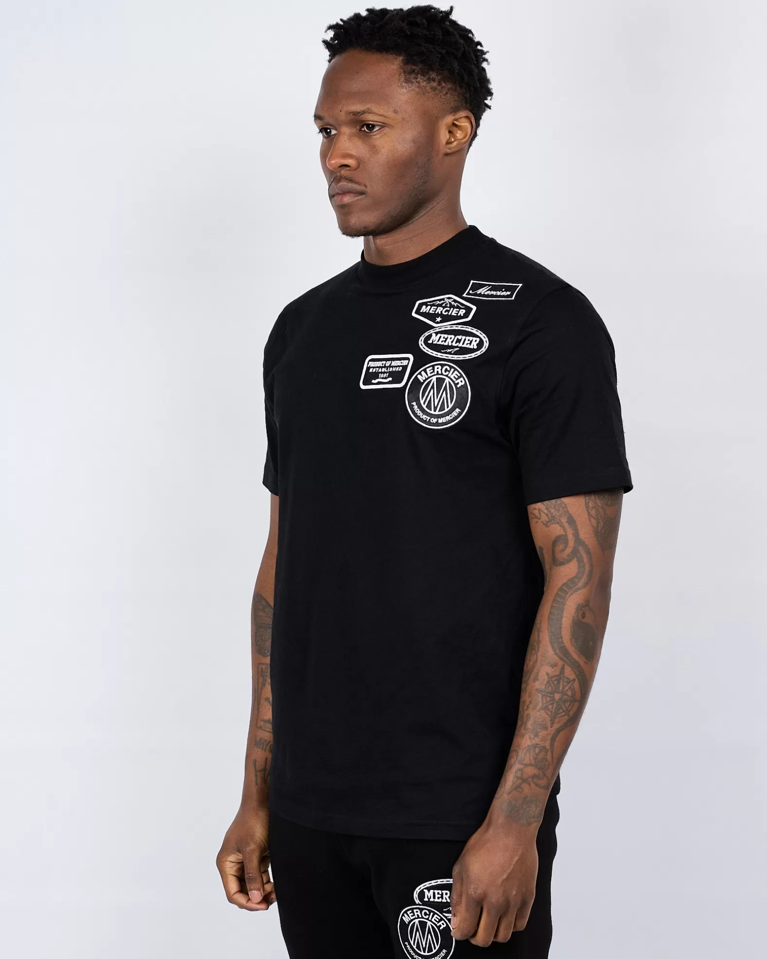 black_mono_badge_mercier_tshirt_2.webp Fashion Mercier Black Mono Badge Tshirt
