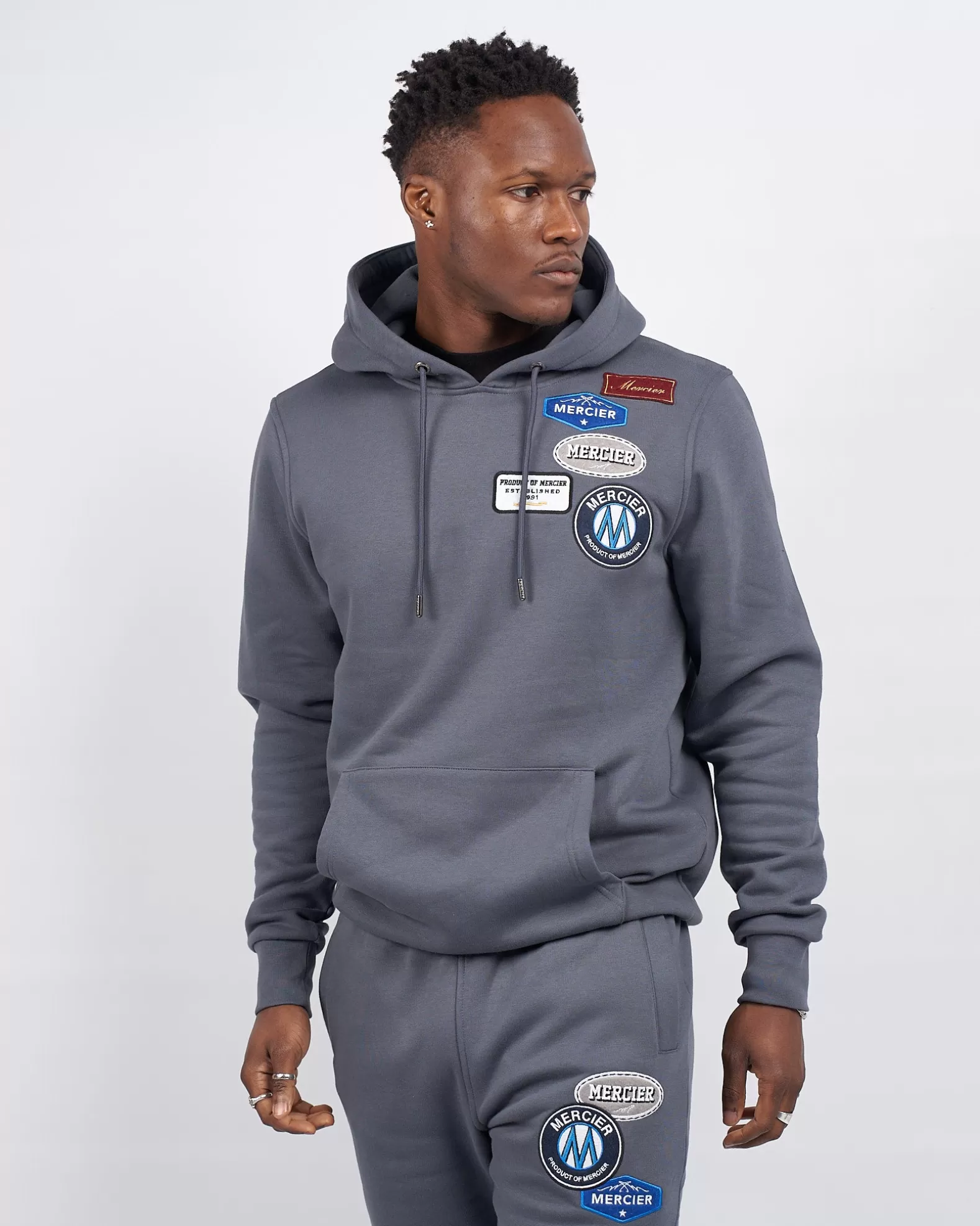 mercier_og_badge_hoodie_turbulence_2.webp Store Mercier OG Badge Hoodie Turbulence