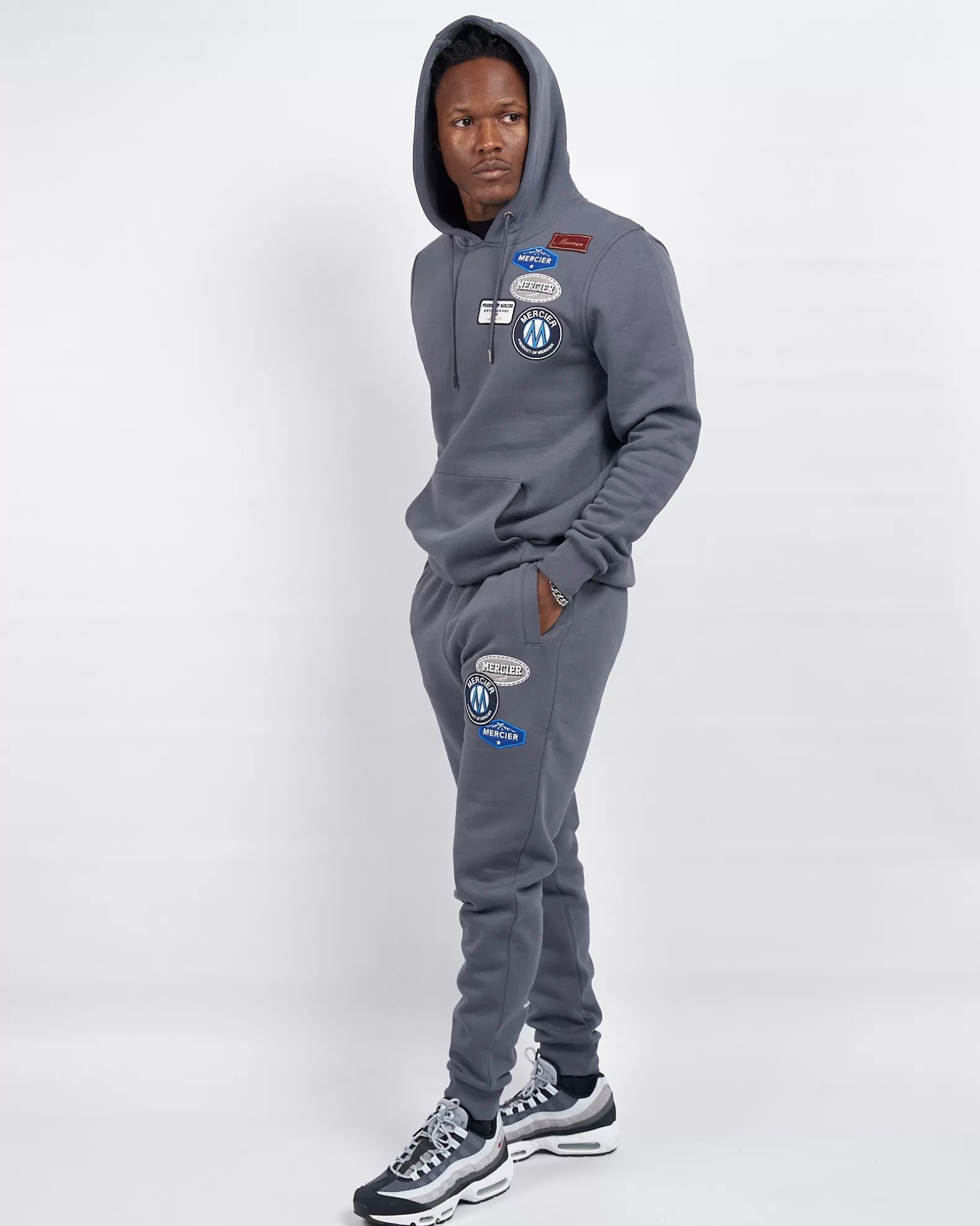 mercier_og_badge_hoodie_turbulence_3.webp Store Mercier OG Badge Hoodie Turbulence