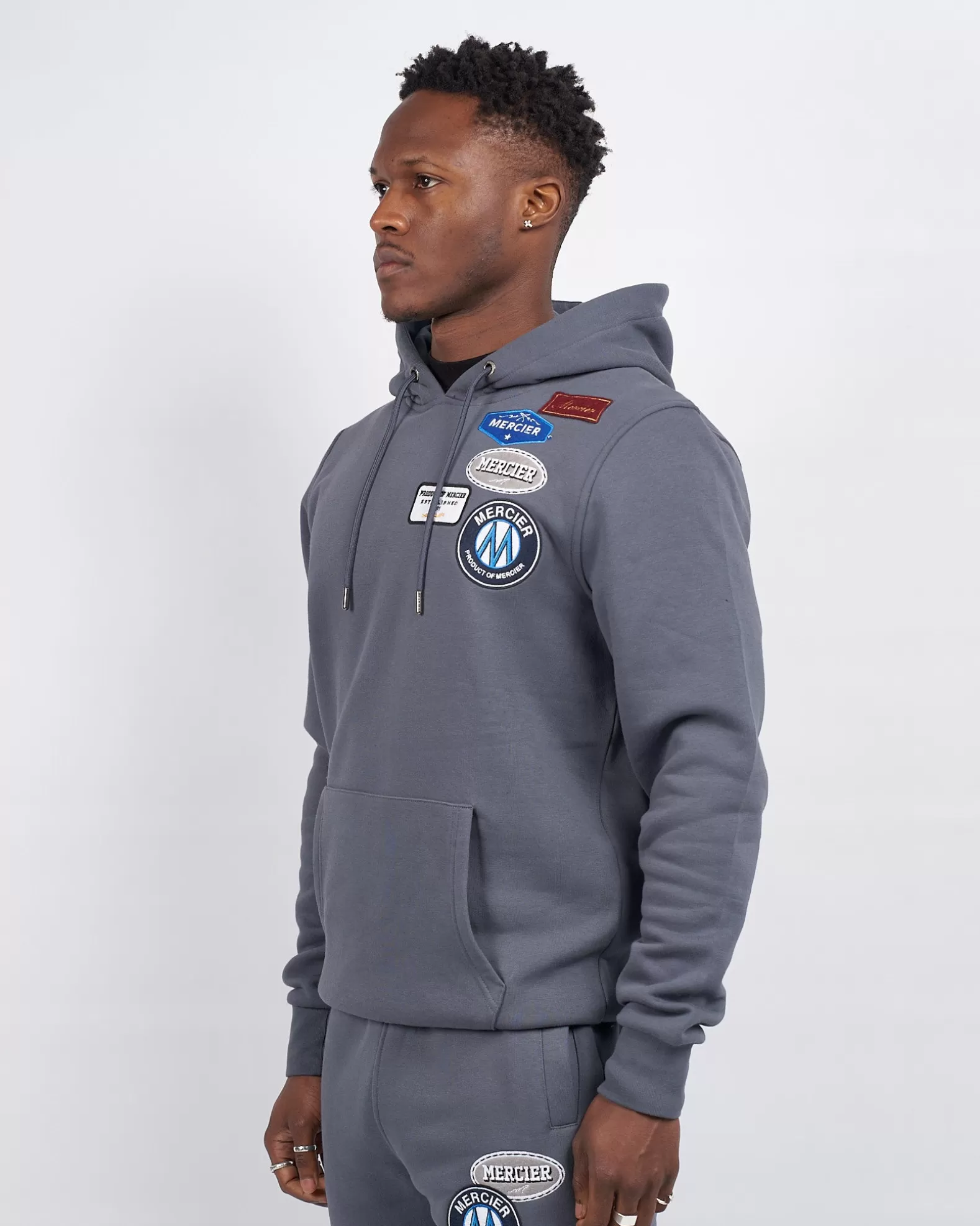 mercier_og_badge_hoodie_turbulence_4.webp Store Mercier OG Badge Hoodie Turbulence
