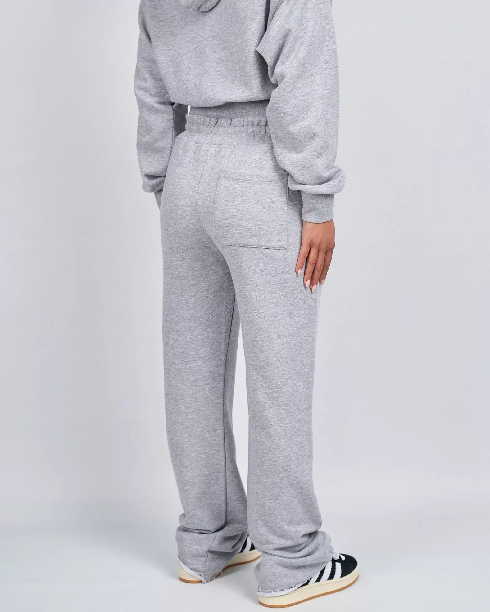womens_grey_marl_og_badge_raw_joggers_2.webp Shop Mercier Womens Grey Marl OG Badge Raw Joggers
